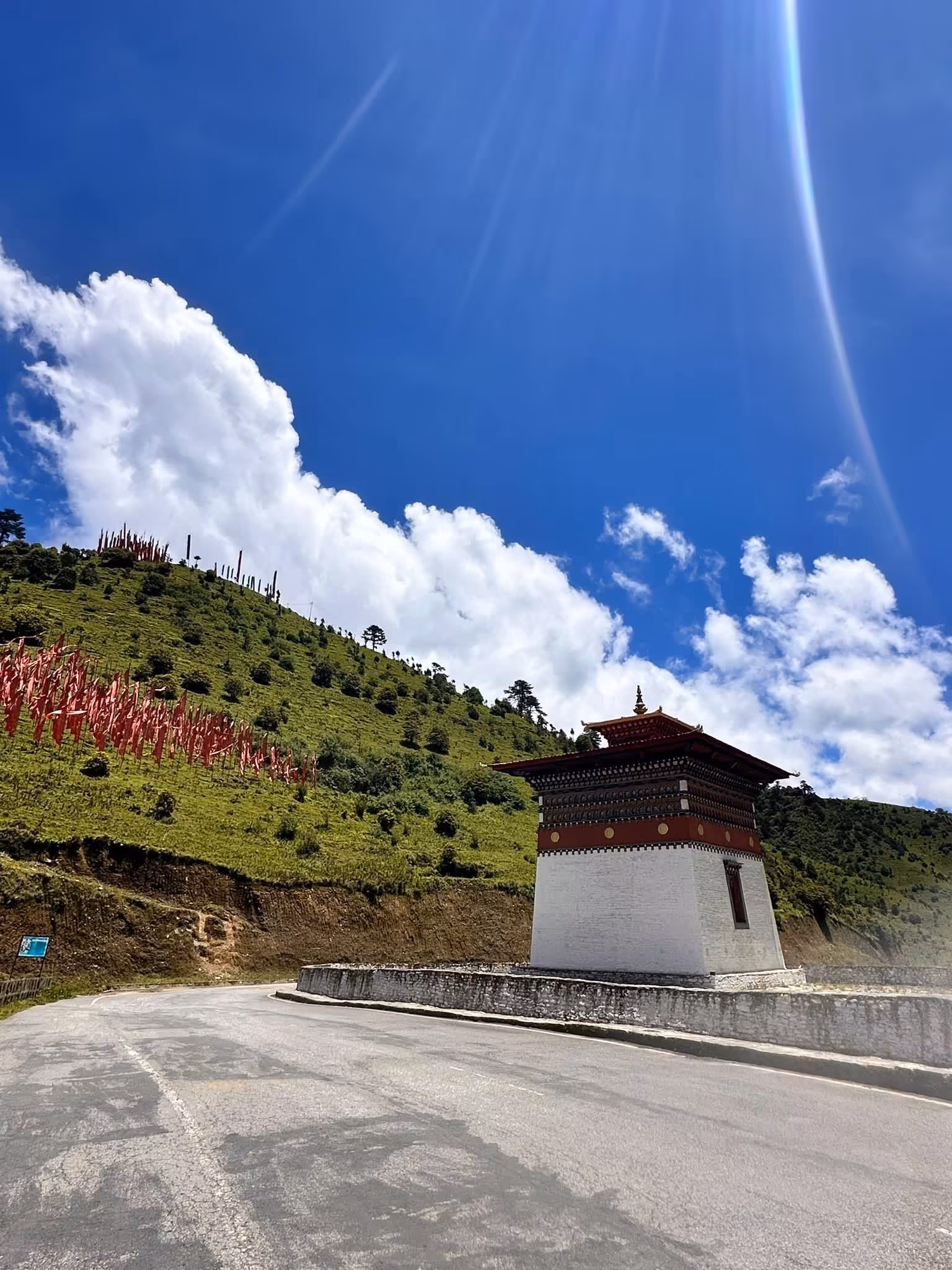 The chorten and highway at Pele La under a big sky