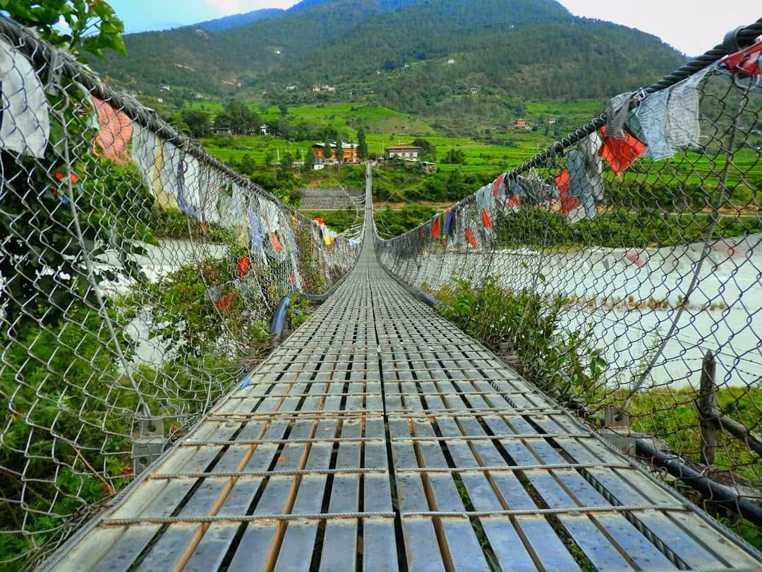 Prayer flags along the deck of the Punakha suspension bridge