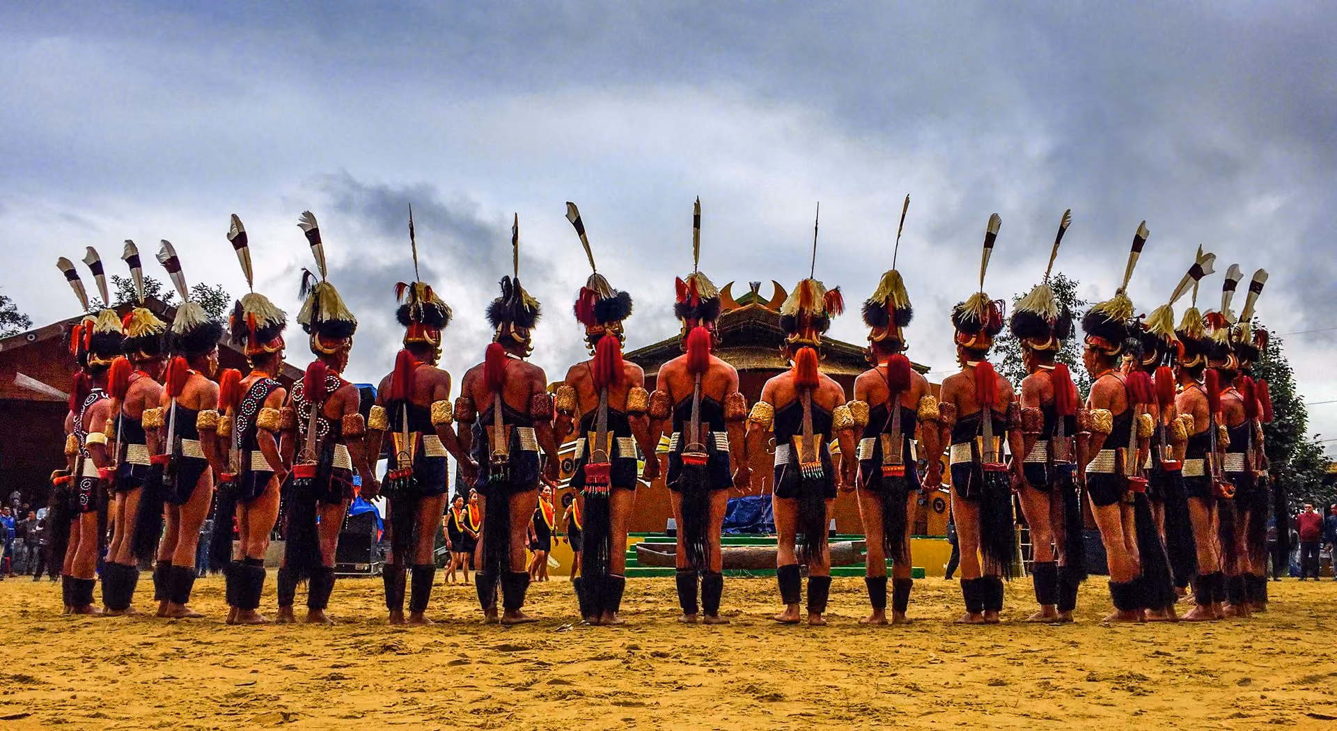 Naga performers in traditional attire lined up at the Hornbill Festival
